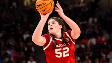 Jan 19, 2025; Columbia, South Carolina, USA; Oklahoma Sooners center Raegan Beers (52) makes a three-point basket against the South Carolina Gamecocks in the second half at Colonial Life Arena.