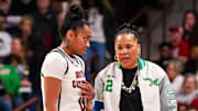 Jan 12, 2025; Columbia, South Carolina, USA; South Carolina Gamecocks head coach Dawn Staley speaks with guard Te-Hina Paopao (0) against the Texas Longhorns in the first half at Colonial Life Arena. Mandatory Credit: Jeff Blake-Imagn Images