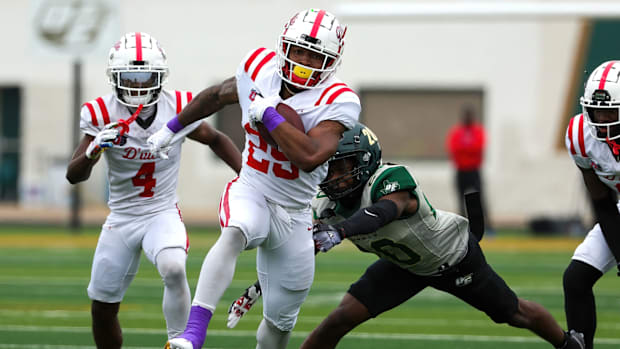 Caden Durham breaks free of a tackle in a 2023 district loss to DeSoto.