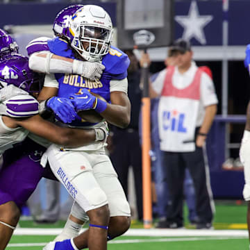 Chapel Hill tailback Rickey Stewart (with ball) in action during the 2023 UIL 4A Division I championship game.