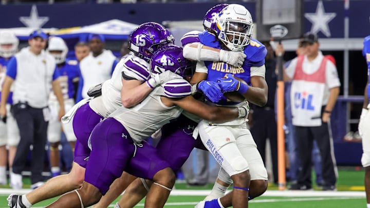 Chapel Hill tailback Rickey Stewart (with ball) in action during the 2023 UIL 4A Division I championship game.