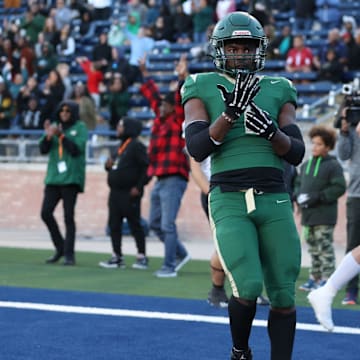 Deondrae Riden points to his ring finger after a back-breaking touchdown in DeSoto's Texas 6A Division II semifinal win over Southlake Carroll in November 2023.