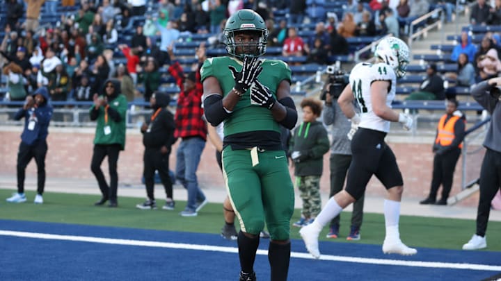 Deondrae Riden points to his ring finger after a back-breaking touchdown in DeSoto's Texas 6A Division II semifinal win over Southlake Carroll in November 2023.