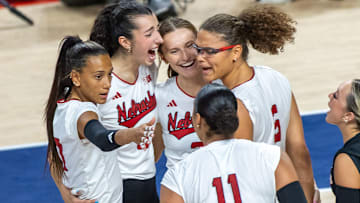 Members of the Husker Volleyball team celebrate after middle blocker Rebekah Allick scored a kill during the second set of the AVCA First Serve.