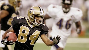 August 26, 2005; NEW ORLEANS, LA, USA;  New Orleans Saints Michael Lewis (84) drives for yardage against the Baltimore Ravens in 1st half action at the Louisiana Superdome. Mandatory Credit: John David Mercer-Imagn Images © 2005 John David Mercer