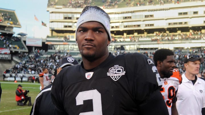 Nov 22, 2009; Oakland, CA, USA; Oakland Raiders quarterback JaMarcus Russell (2) walks off the field after the game against the Cincinnati Bengals at the Oakland-Alameda County Coliseum. The Raiders defeated the Bengal 20-17. Mandatory Credit: Kirby Lee/Image of Sport-Imagn Images