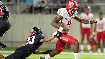 North Shore's Kaleb Bailey races past a Westfield defender in a win during the 2023 Texas high school football season.