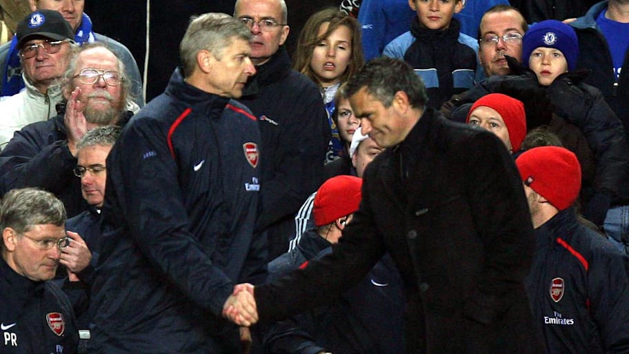 Arsène Wenger (left) and José Mourinho shaking hands.