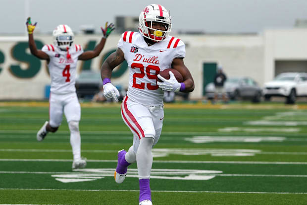 Caden Durham breaks away for a touchdown run during the 2023 district loss to DeSoto.