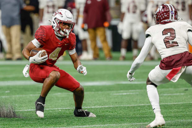 Damien Henderson squares up a Coffee defender during Creekside's Georgia 5A state championship loss in 2023.