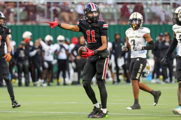 Daylan McCutcheon motions for a first down in a 2023 matchup with South Oak Cliff in a showdown of Texas high school powers.