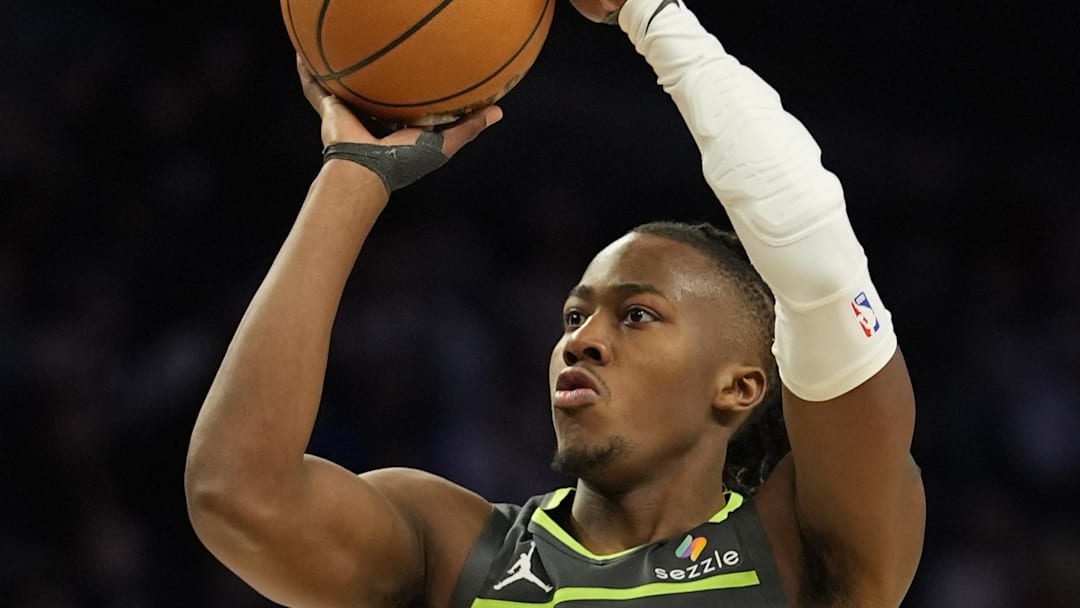 Mar 17, 2026; Minneapolis, Minnesota, USA; Minnesota Timberwolves guard Ayo Dosunmu (13) shoots against the Phoenix Suns in the third quarter at Target Center. Mandatory Credit: Bruce Kluckhohn-Imagn Images