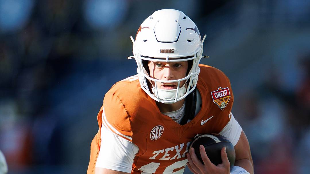 Texas Longhorns quarterback Arch Manning (16) runs with the ball against the Michigan Wolverines during the first half at Camping World Stadium. Texas Longhorns quarterback Arch Manning (16) runs with the ball against the Michigan Wolverines during the first half at Camping World Stadium.