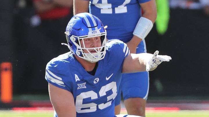 Nov 8, 2025; Lubbock, Texas, USA;  Brigham Young Cougars offensive center Bruce Mitchell (63) gestures before a play in the first half against the Texas Tech Red Raiders at Jones AT&T Stadium. Mandatory Credit: Michael C. Johnson-Imagn Images