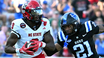 Sep 20, 2025; Durham, North Carolina, USA;  North Carolina State Wolfpack wide receiver Terrell Anderson (9) runs the ball during the second quarter against Duke Blue Devils cornerback Landan Callahan (21) at Wallace Wade Stadium. Mandatory Credit: Zachary Taft-Imagn Images
