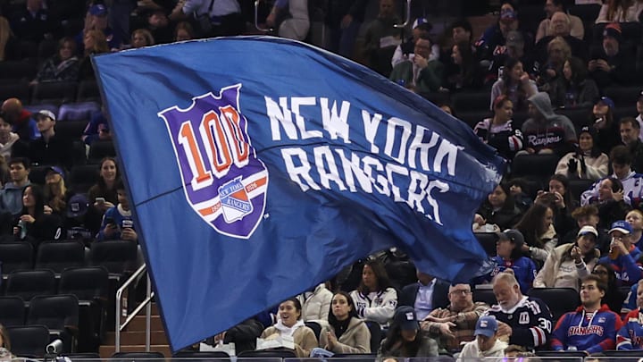 Oct 23, 2025; New York, New York, USA;  A flag commemorating the New York Rangers 100th season at Madison Square Garden. 