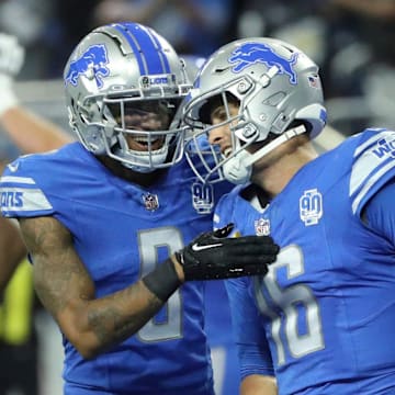 Detroit Lions wide receiver Josh Reynolds (8) and quarterback Jared Goff (16) 