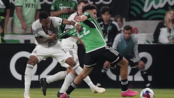 Austin FC midfielder Sofiane Djeffal (22) fights for the ball against Toronto FC midfielder Mark-Anthony Kaye (14) during the game at Q2 Stadium 