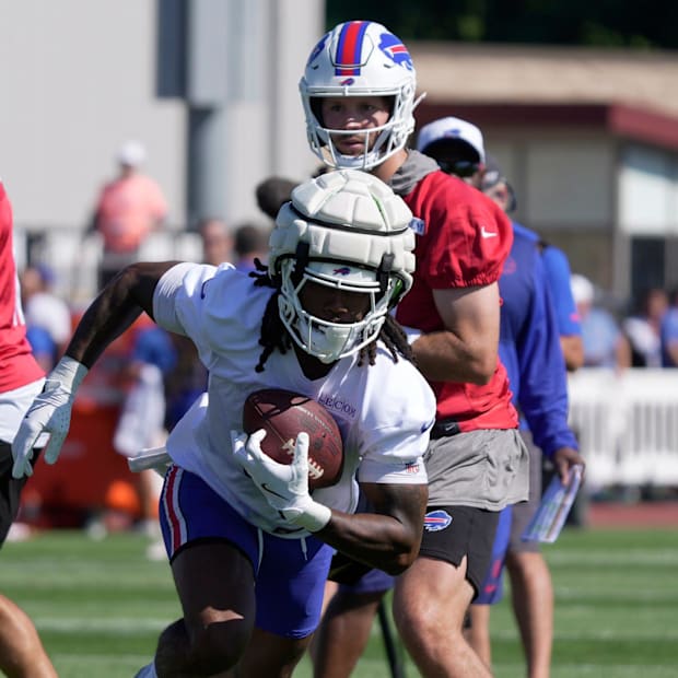 Buffalo Bills quarterback Josh Allen and running back James Cook during a training camp practice.