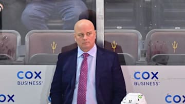 Jan 9, 2024; Tempe, Arizona, USA; Boston Bruins head coach Jim Montgomery looks on in the first period against the Arizona Coyotes at Mullett Arena. Mandatory Credit: Matt Kartozian-Imagn Images