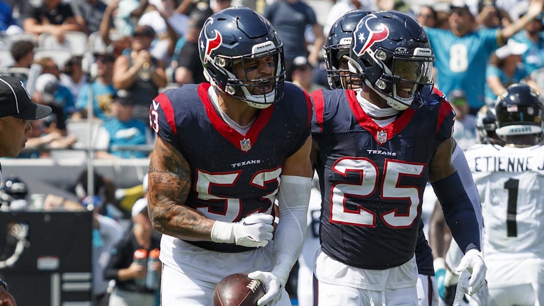 Sep 24, 2023; Jacksonville, Florida, USA; Houston Texans linebacker Blake Cashman (53) and safety Grayland Arnold (25) celebrate a fumble recovery against the Jacksonville Jaguars during the second quarter at EverBank Stadium. Mandatory Credit: Morgan Tencza-Imagn Images