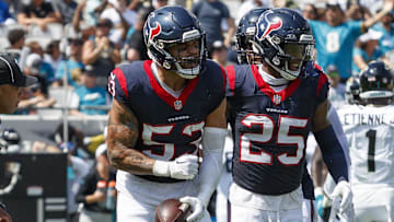 Sep 24, 2023; Jacksonville, Florida, USA; Houston Texans linebacker Blake Cashman (53) and safety Grayland Arnold (25) celebrate a fumble recovery against the Jacksonville Jaguars during the second quarter at EverBank Stadium. Mandatory Credit: Morgan Tencza-Imagn Images