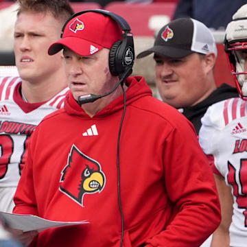 White Louisville’s head coach Jeff Brohm watches his team against Red Louisville in the Spring Game Friday night at L&N Stadium.