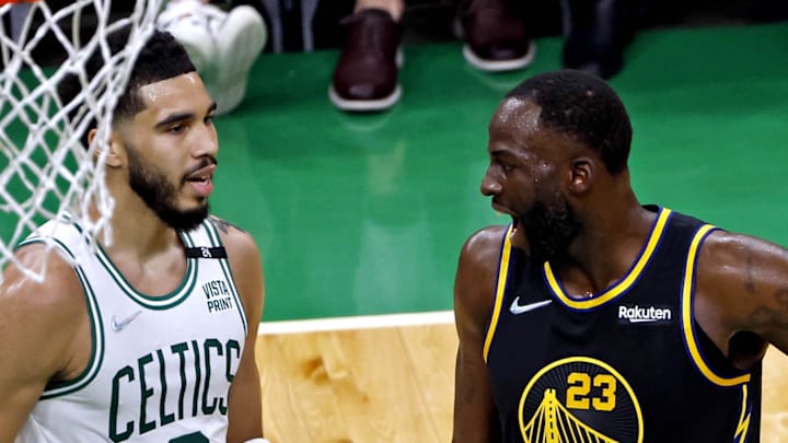 Jun 8, 2022; Boston, Massachusetts, USA; Boston Celtics forward Jayson Tatum (0) talks with Golden State Warriors forward Draymond Green (23) during the second quarter in game three of the 2022 NBA Finals at TD Garden. 