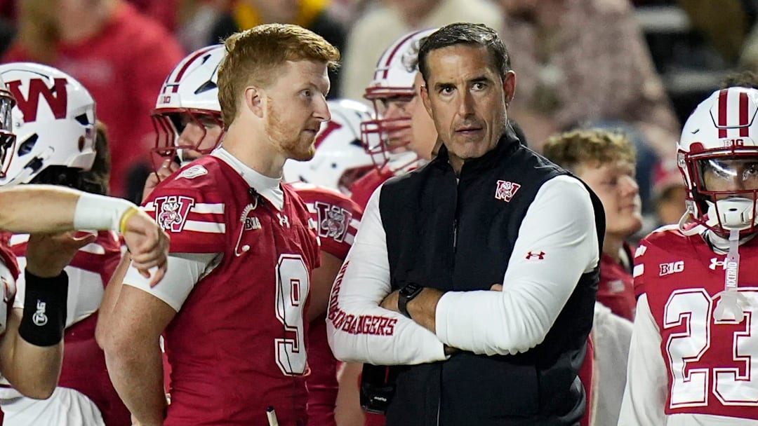 Wisconsin Badgers head coach Luke Fickell stands next to injured quarterback Billy Edwards Jr. during the second half of the game against the Iowa Hawkeyes, October 11, 2025, at Camp Randall in Madison