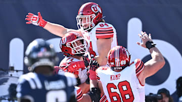 Sep 14, 2024; Logan, Utah, USA; Utah Utes tight end Caleb Lohner (84) celebrates after catching a touchdown pass in the first half against the Utah State Aggies at Merlin Olsen Field at Maverik Stadium. 