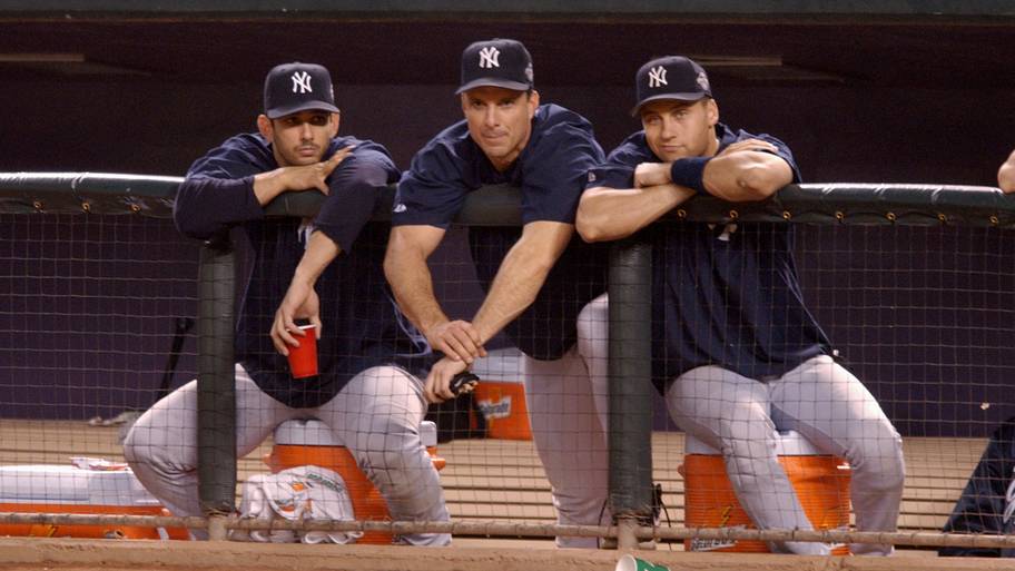 Jorge Posada, Tino Martinez and Derek Jeter watch as the Yankees lose Game 6 of the 2001 World Series.