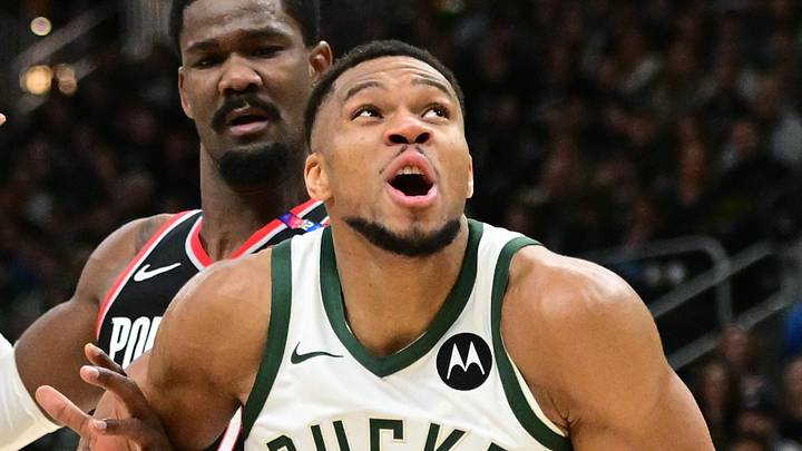 Jan 4, 2025; Milwaukee, Wisconsin, USA;  Milwaukee Bucks forward Giannis Antetokounmpo (34) looks for a shot against Portland Trail Blazers forward Deni Avdija (8) and  center Deandre Ayton (2) in the fourth quarter at Fiserv Forum. Mandatory Credit: Benny Sieu-Imagn Images