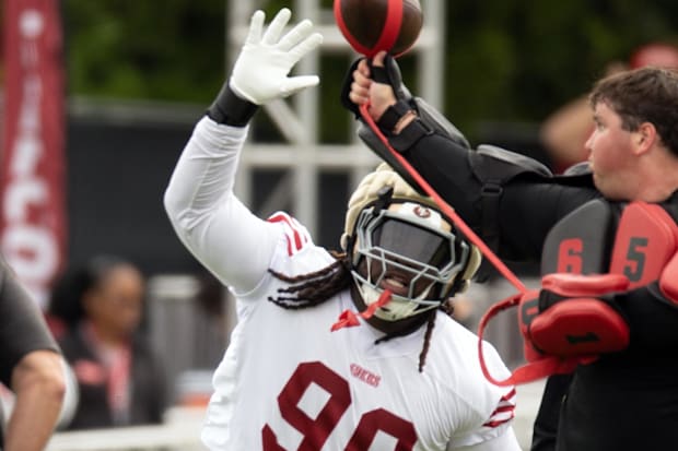 San Francisco 49ers defensive tackle CJ West (99) swats at a ball during a pass rushing drill on the second day of training c