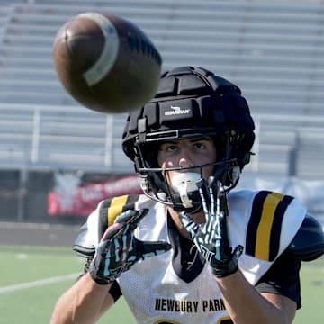 Shane Rosenthal catches a pass during a Newbury Park High football practice on Friday, Aug. 16, 2024. Rosenthal led the state in receptions (122), receiving yardage (1,948) and interceptions (12) in his junior season.