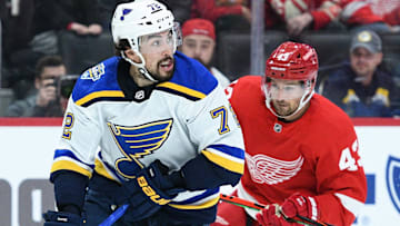 Oct 27, 2019; Detroit, MI, USA; St. Louis Blues defenseman Justin Faulk (72) handles the puck as Detroit Red Wings defenseman Alex Biega (3) defends during the second period at Little Caesars Arena. Mandatory Credit: Tim Fuller-Imagn Images