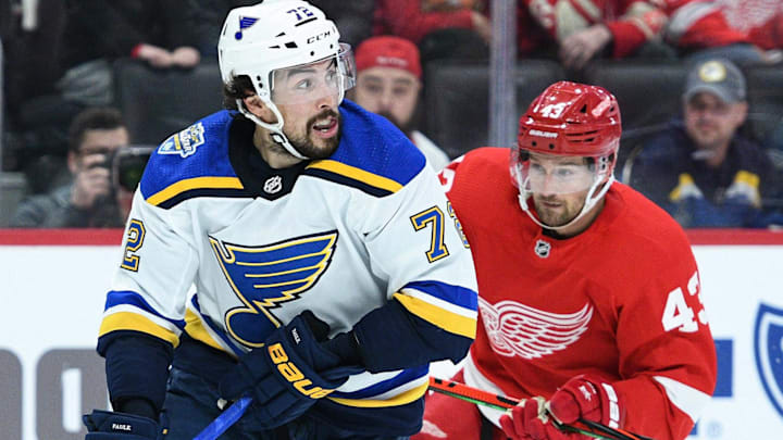 Oct 27, 2019; Detroit, MI, USA; St. Louis Blues defenseman Justin Faulk (72) handles the puck as Detroit Red Wings defenseman Alex Biega (3) defends during the second period at Little Caesars Arena. Mandatory Credit: Tim Fuller-Imagn Images