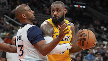 Los Angeles Lakers forward LeBron James (23) dribbles against San Antonio Spurs guard Chris Paul (3) in the second half at Frost Bank Center.