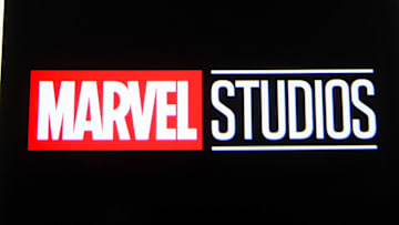 In this photo illustration a Marvel Studios logo is seen on...