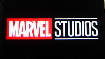 In this photo illustration a Marvel Studios logo is seen on...