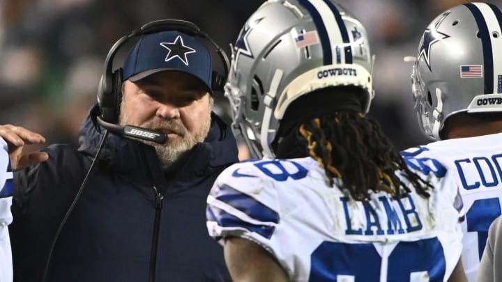 Jan 8, 2022; Philadelphia, Pennsylvania, USA; Dallas Cowboys head coach Mike McCarthy (M) celebrates with Cowboys wide receiver CeeDee Lamb (88) on the sidelines after a touchdown against the Philadelphia Eagles during the second quarter at Lincoln Financial Field. 