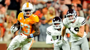 Tennessee's Boo Carter runs with the ball against Mississippi State during a 2024 game at Neyland Stadium. The SEC plays eight conference game. The Big Ten plays nine and would like the SEC to reduce its number of cupcake games, but might that backfire on the Big Ten?