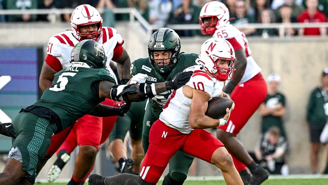 Anthony Colandrea uses the blocking of center Justin Evans (51) and guard Paul Mubenga (65) to gain yardage last week against Michigan State. Anthony Colandrea uses the blocking of center Justin Evans (51) and guard Paul Mubenga (65) to gain yardage last week against Michigan State.