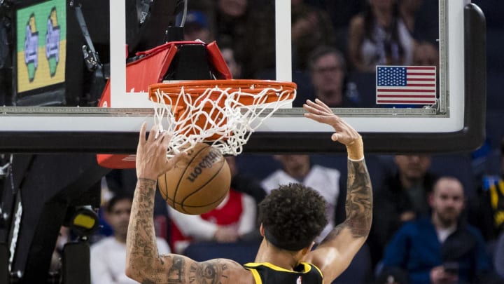 Jan 7, 2024; San Francisco, California, USA;  Golden State Warriors guard Lester Quinones (25) dunks against the Toronto Raptors during the second half at Chase Center. Mandatory Credit: John Hefti-USA TODAY Sports
