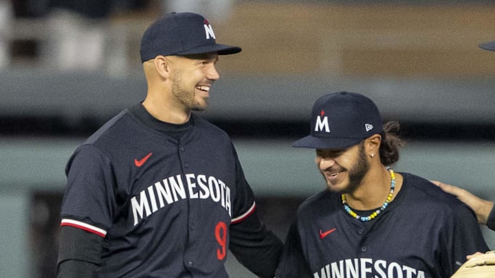 Apr 22, 2024; Minneapolis, Minnesota, USA; Minnesota Twins left fielder Trevor Larnach (9), center fielder Austin Martin (82) and right fielder Max Kepler (26) celebrate after defeating the Chicago White Sox at Target Field. Mandatory Credit: Jesse Johnson-Imagn Images