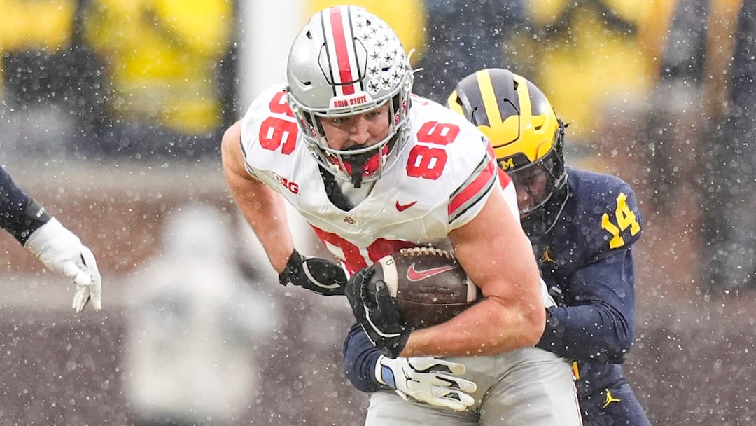 Ohio State tight end Max Klare (86) makes a catch against Michigan defensive back Jordan Young (14) during the second half at Michigan Stadium in Ann Arbor on Saturday, Nov. 29, 2025.