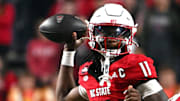 Nov 1, 2025; Raleigh, North Carolina, USA;  North Carolina State Wolfpack quarter back CJ Bailey (11) throws a pass during the first quarter against the Georgia Tech Yellow Jackets at Carter-Finley Stadium. Mandatory Credit: Zachary Taft-Imagn Images