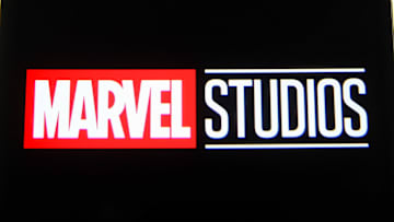 In this photo illustration a Marvel Studios logo is seen on...