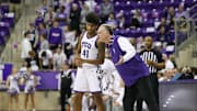 TCU men's basketball head coach Jamie Dixon talks with guard Jace Posey in the Frogs' win over West Virginia on Wednesday, February 5, 2025.