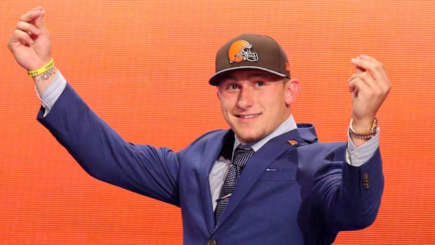 May 8, 2014; New York, NY, USA; Johnny Manziel (Texas A&M) gestures as he walks across the stage after being selected as 
