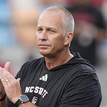 Sep 7, 2024; Charlotte, North Carolina, USA; North Carolina State Wolfpack head coach Dave Doeren during pregame activities against the Tennessee Volunteers at the Dukes Mayo Classic at Bank of America Stadium. Mandatory Credit: Jim Dedmon-Imagn Images